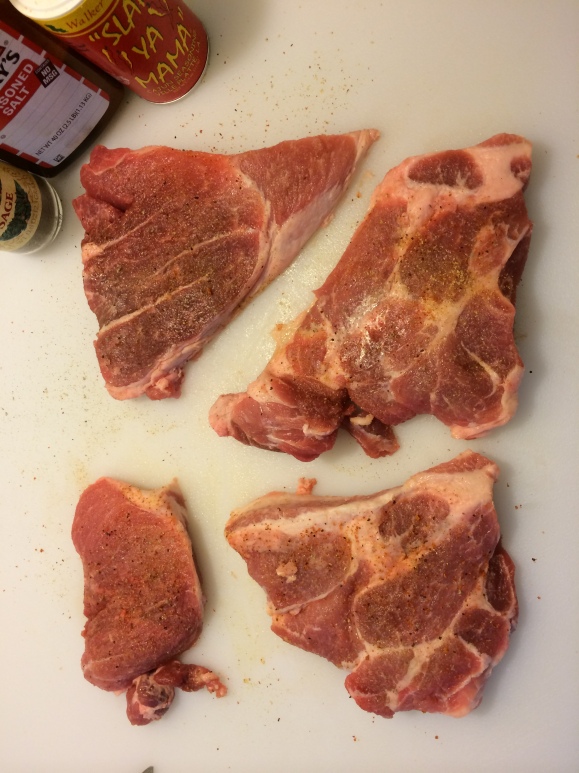 Halved, seasoned pork steaks